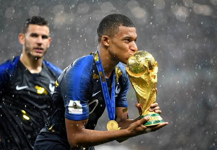 kylian mbappe with fifa world trophy